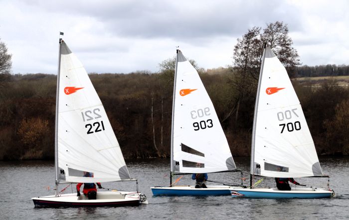 Comet Class dinghies competing on Chipstead Lake