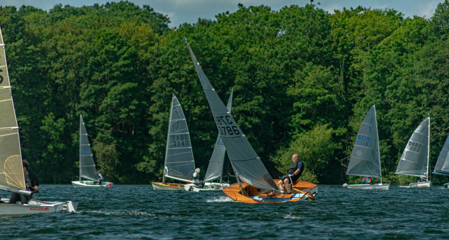 a-couple-of-sailboats-on-a-lake-ai-generated-cont A couple of sailboats on a lake AI-generated content may be incorrect.