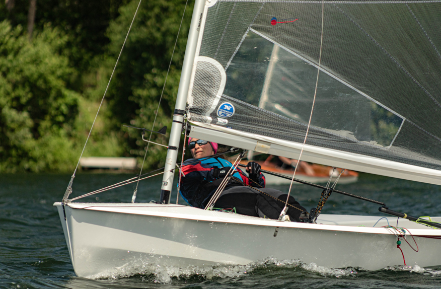 A person in a sailboat AI-generated content may be incorrect.