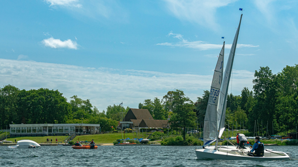 A sailboat on a lake AI-generated content may be incorrect.